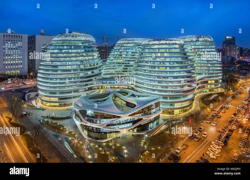 O Galaxy SOHO à noite, iluminado e destacando-se na paisagem urbana de Pequim.